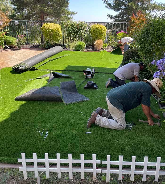 Artificial turf installation in progress.